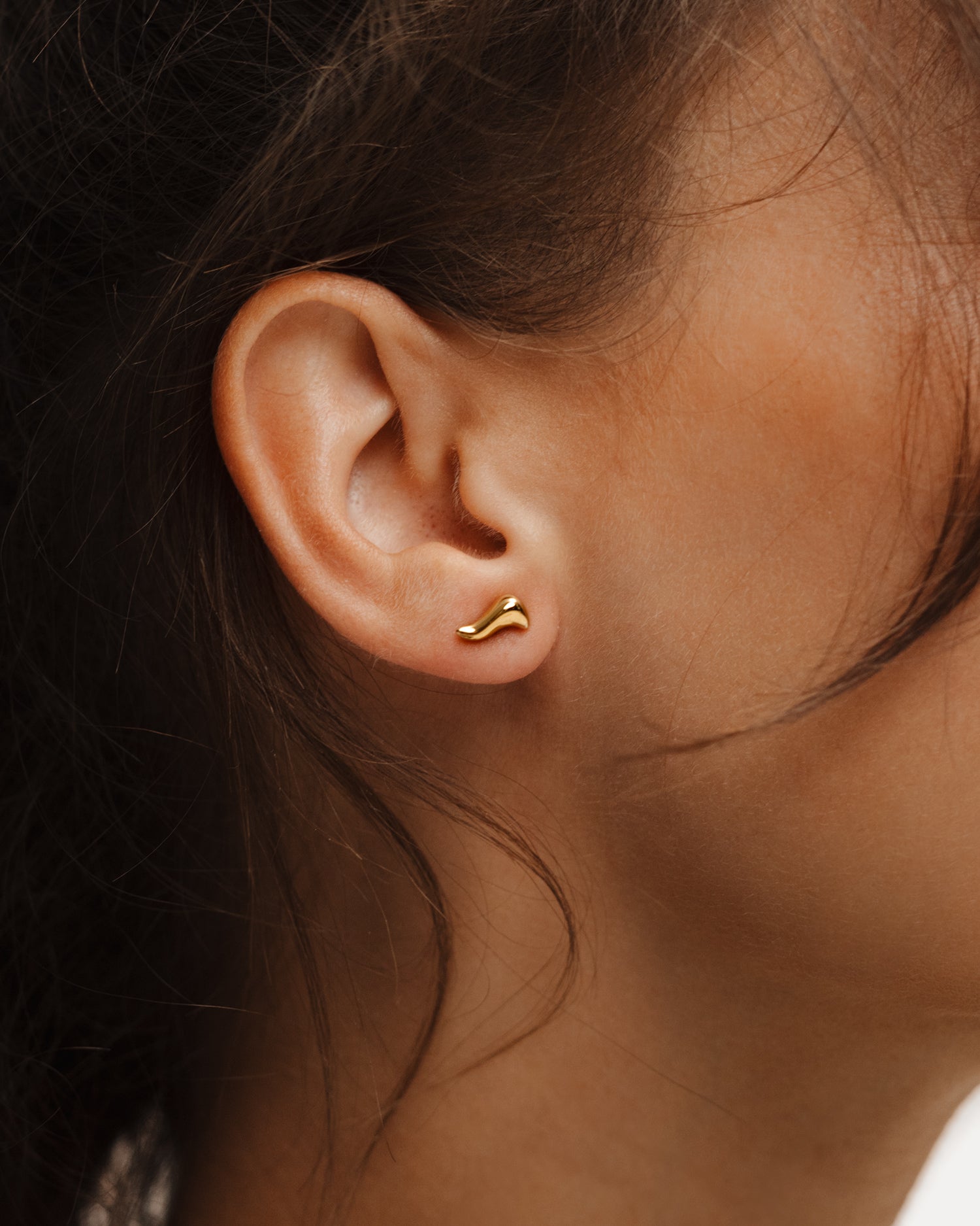 Poise Flow Stud Earrings, recycled 18k Gold Vermeil, shown on ear - NATALIE GRASSI