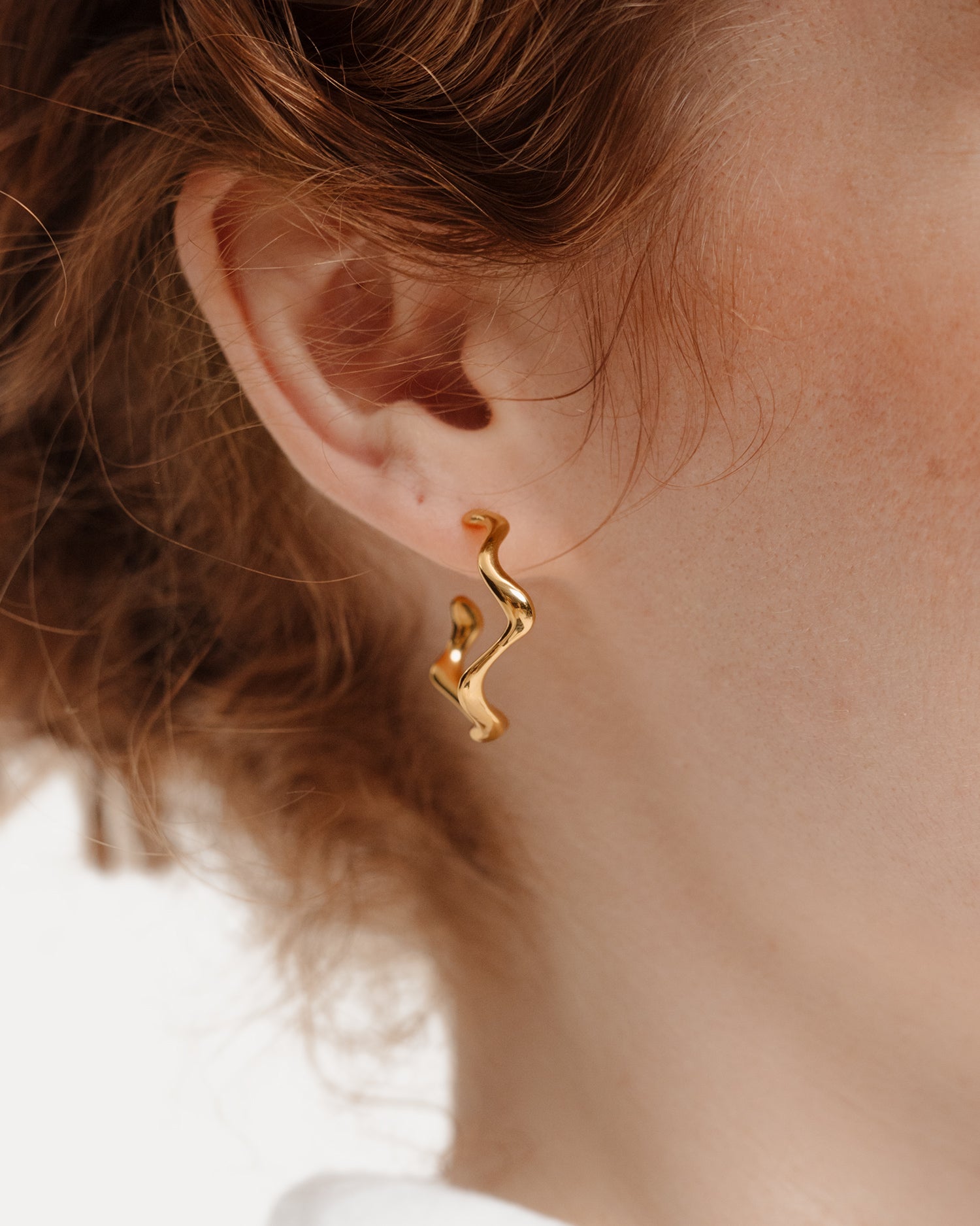 Poise Wave Hoop Earrings Large, recycled 18k Gold Vermeil, shown on ear - NATALIE GRASSI
