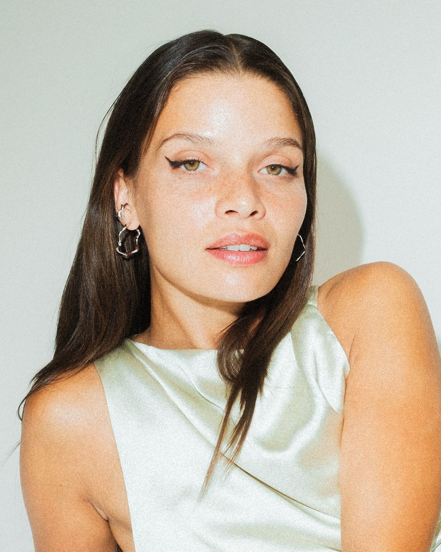 Poise Wave Hoop Earrings Large, recycled Sterling Silver, shown on model - NATALIE GRASSI