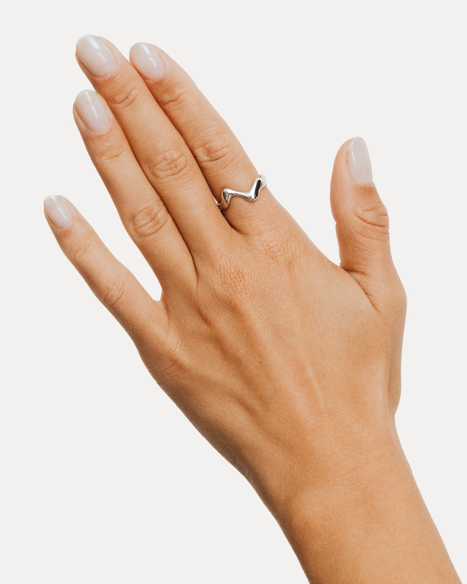 Poise Wave Ring, recycled Sterling Silver, shown on hand - NATALIE GRASSI