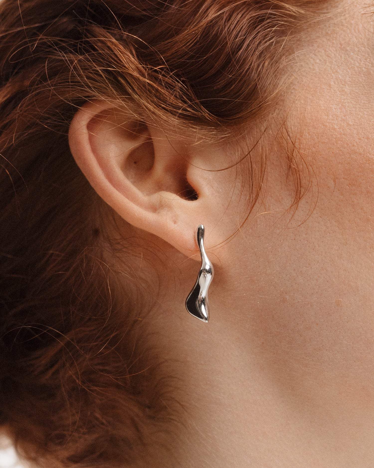 Poise Molten Drop Earrings, recycled Sterling Silver, shown on ear - VEYIA Berlin