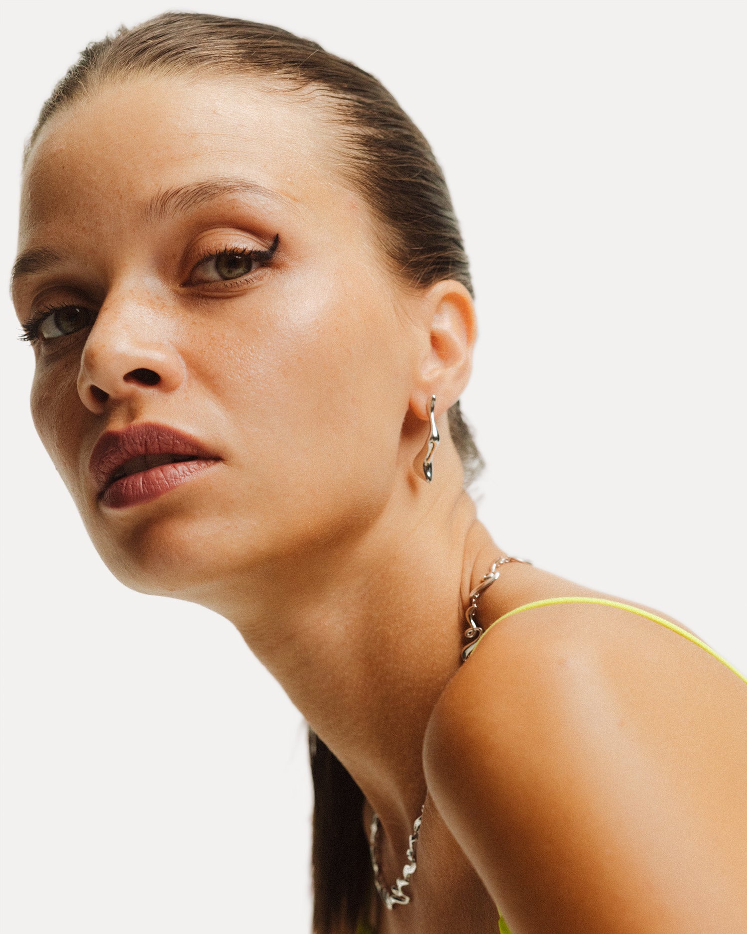 Poise Molten Drop Earrings, recycled Sterling Silver, styled with silver jewelry - VEYIA Berlin